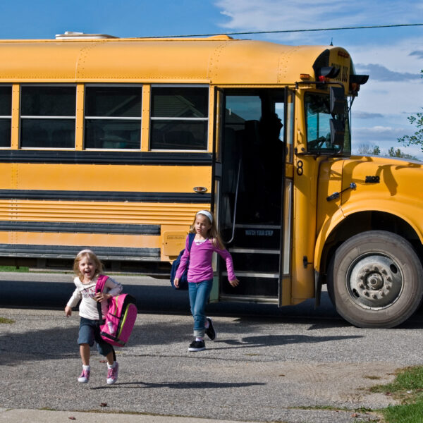 Children Running Off Of Bus