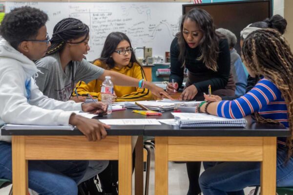 High school students working together at a table
